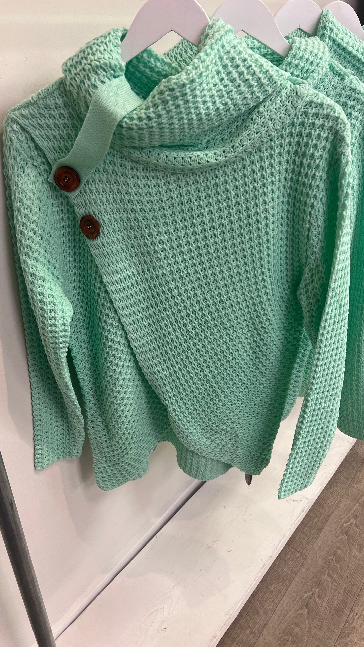 Asymmetrical Hem Sweater with Wood Buttons in Green Mint